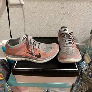 Grey & pink Nike Free Air shoes